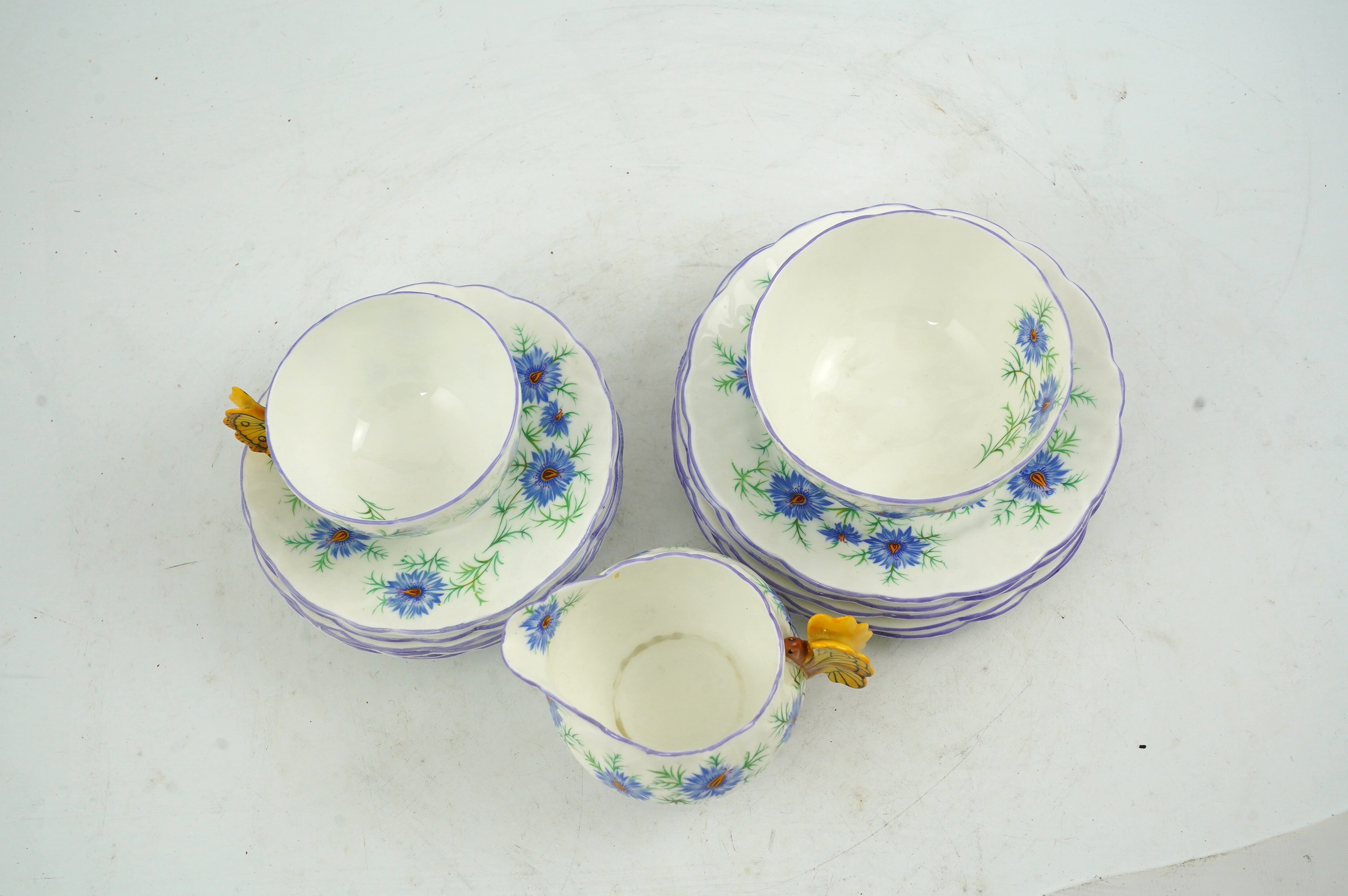 An Art Deco Aynsley cornflower pattern bone china twenty piece part tea set with butterfly handles